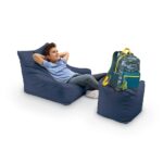 beanie outdoor fava lounge chair and square ottoman combo w kid model and backpack navy 50057.1618489380.1280.1280